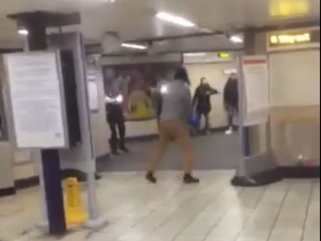 The terrorist stabber pictured centre at Leytonstone underground station.