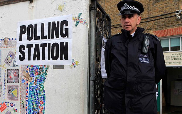 Police outside a polling station in Tower Hamlets in order to deter voters from being intimidated