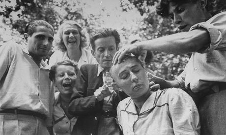 Woman accused of collaboration with the Nazis gets publicly shamed by having her head shaved by members of the French Resistance.